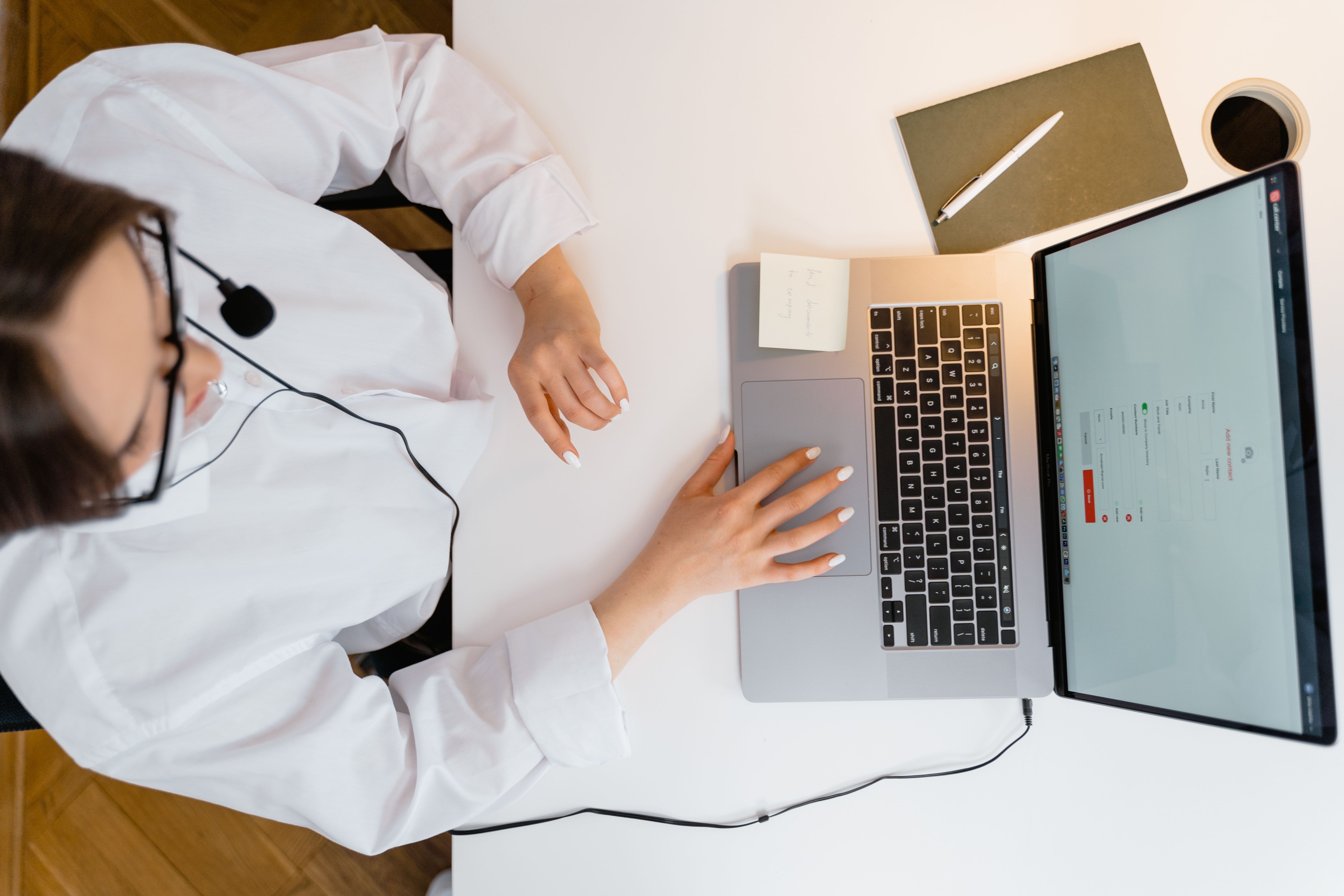 Virtual assistant researching leads from a laptop